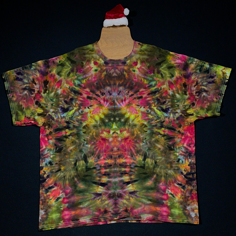 An example depicting the front side of a third different custom handmade-to-order Merry Mindscape ice tie dyed shirt design. A Christmas inspired abstract, symmetrical pattern featuring a festive array of red, green & gold shades