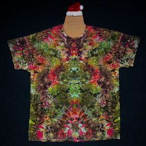 Front side of a Merry Mindscape ice tie dyed t-shirt design, an abstract, symmetrical Christmas inspired wearable art featuring a festive array of red, green & gold shades