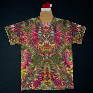 The front side of another custom handmade-to-order Merry Mindscape ice tie dyed shirt design. A Christmas inspired abstract, symmetrical pattern featuring a festive array of red, green & gold shades