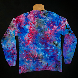 Back side of a cloud 9 long sleeve tie dye shirt design; a marbled splatter ice dyed pattern featuring a dreamy array of blues & pinks, laying flat on a solid black background 