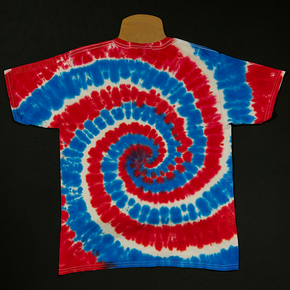 Back side of a red, white & blue USA American flag inspired tie dye t-shirt design. Short sleeve, crewneck style tee perfect for Fourth of July