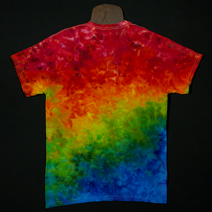 The back side of a handmade to order rainbow splatter ice dye gradient short sleeve shirt