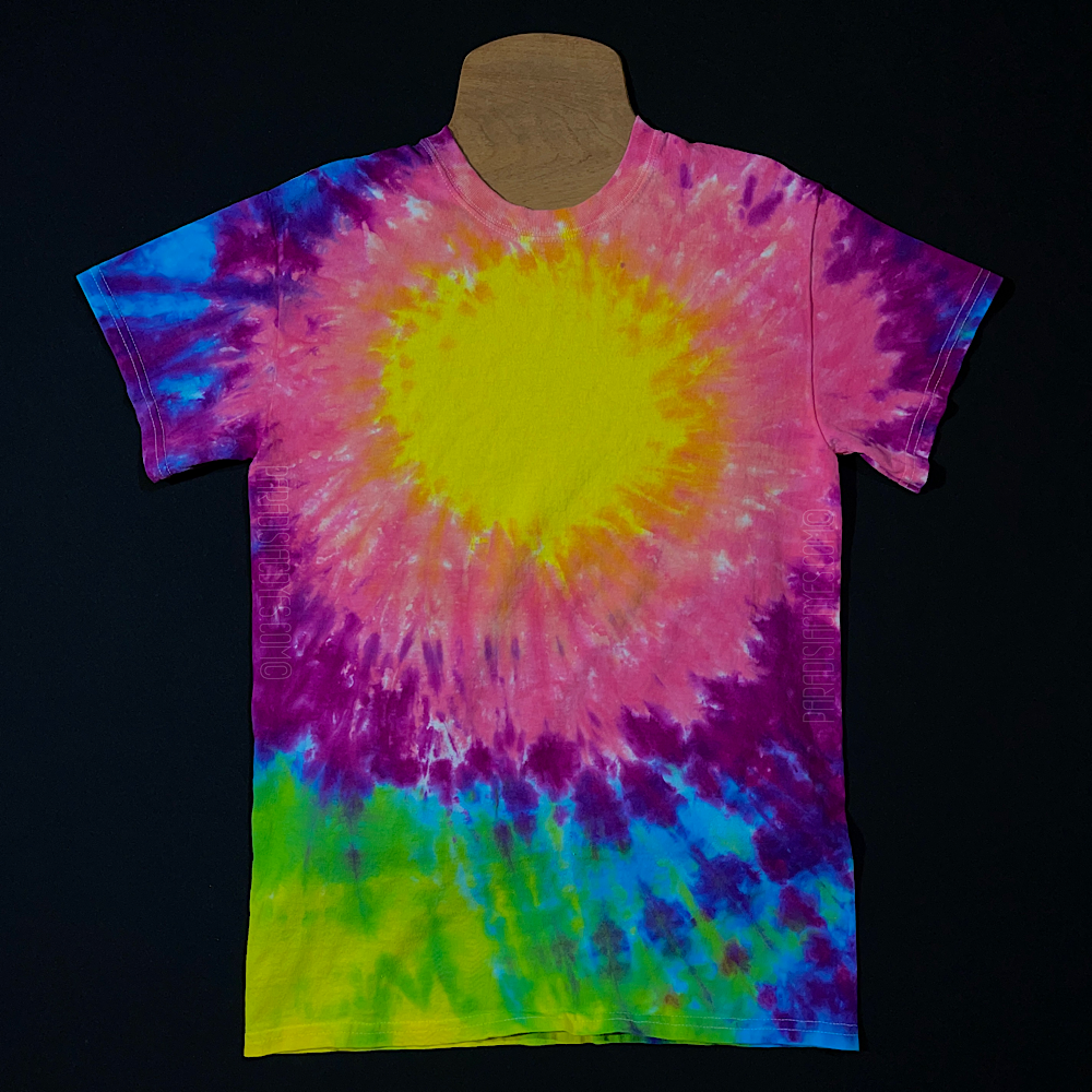 A neon rainbow sunburst tie dye design short sleeve shirt, designed for a center upper chest logo placement
