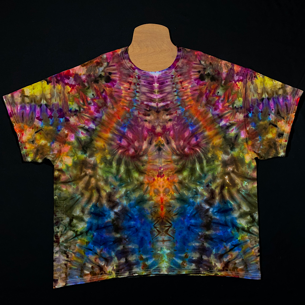 Front side of a hand-dyed, one of a kind adult 3XL Gildan Ultra Cotton Short Sleeve Shirt featuring an abstract, symmetrical rainbow ice dyed design