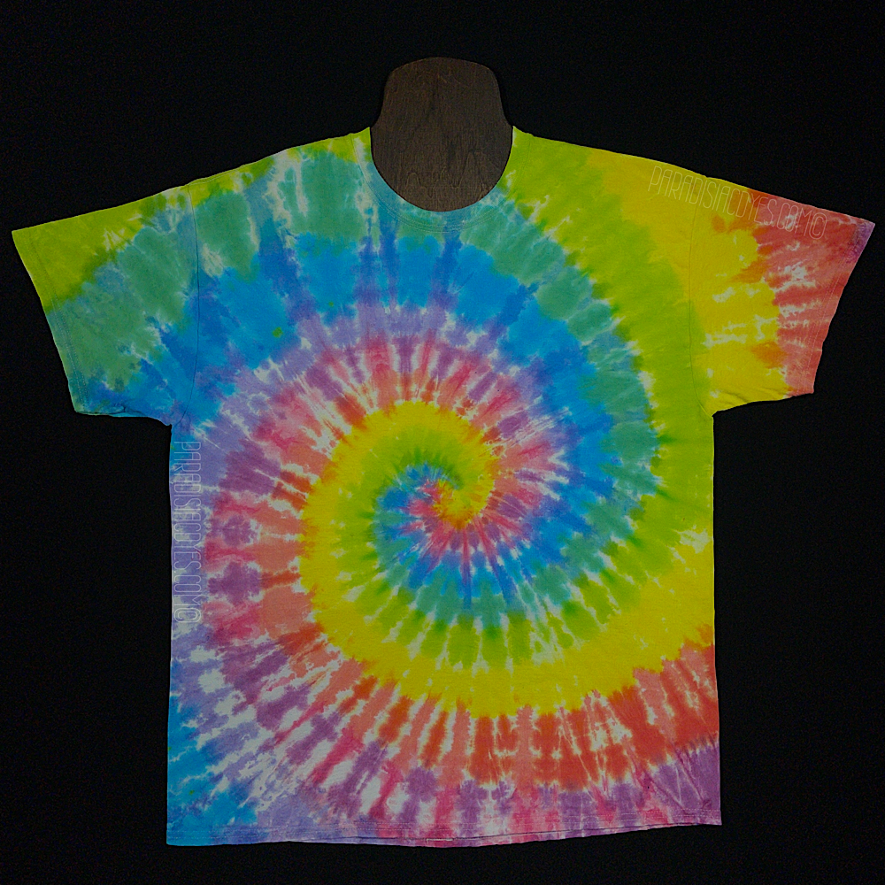 Front side of a pastel rainbow spiral tie dye t-shirt, featuring bubblegum pink, peach, bright yellow, lime green and light sky blue shades
