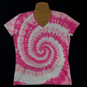 Front side of a ladies v-neck style short sleeve tie dye shirt in the bubblegum pink spiral design