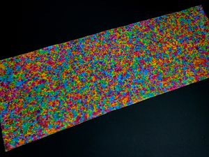 A full view of a hand-dyed, one of kind speckled rainbow splatter pattern tie dye body pillow pillowcase