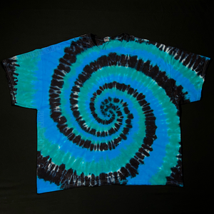 Front side of a spiral design short sleeve tie dye shirt, featuring vibrant, electric blue, teal and rich black