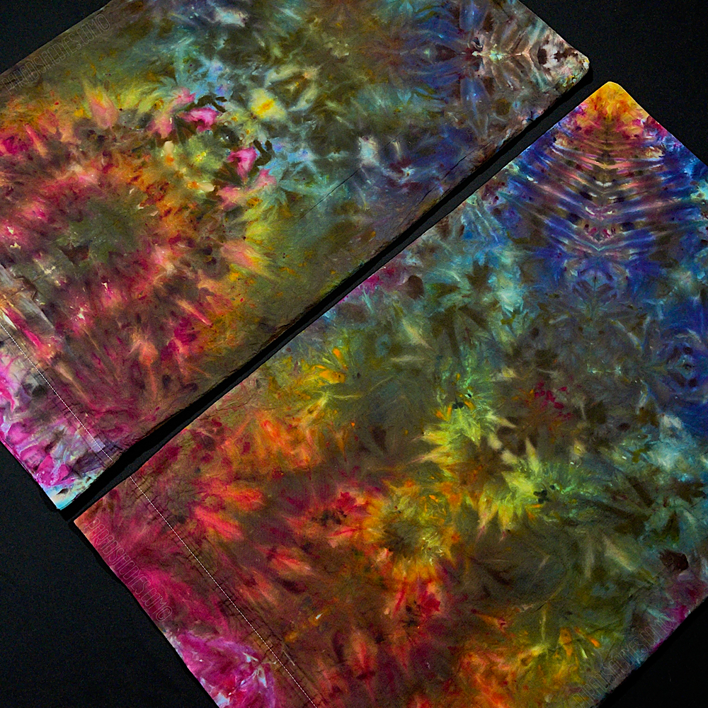 An angled, close up shot of the two standard size, 300 thread count pillowcases included in this set of 2 symmetrical, psychedelic mindscape ice dye set