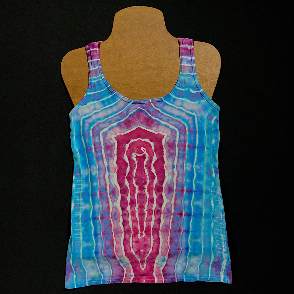 Front side of a ladies' racerback style tank featuring an agate geode inspired ice dyed design, with a giant, single vertical, oblong geode on the front featuring a hot pink center, transitioning to dreamy, baby blue shades as the bands expand outward 