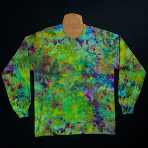 Front side of a marijuana bud inspired tie dye splatter design featuring green and purple shades, in a speckled pattern reminiscent of a weed nug 