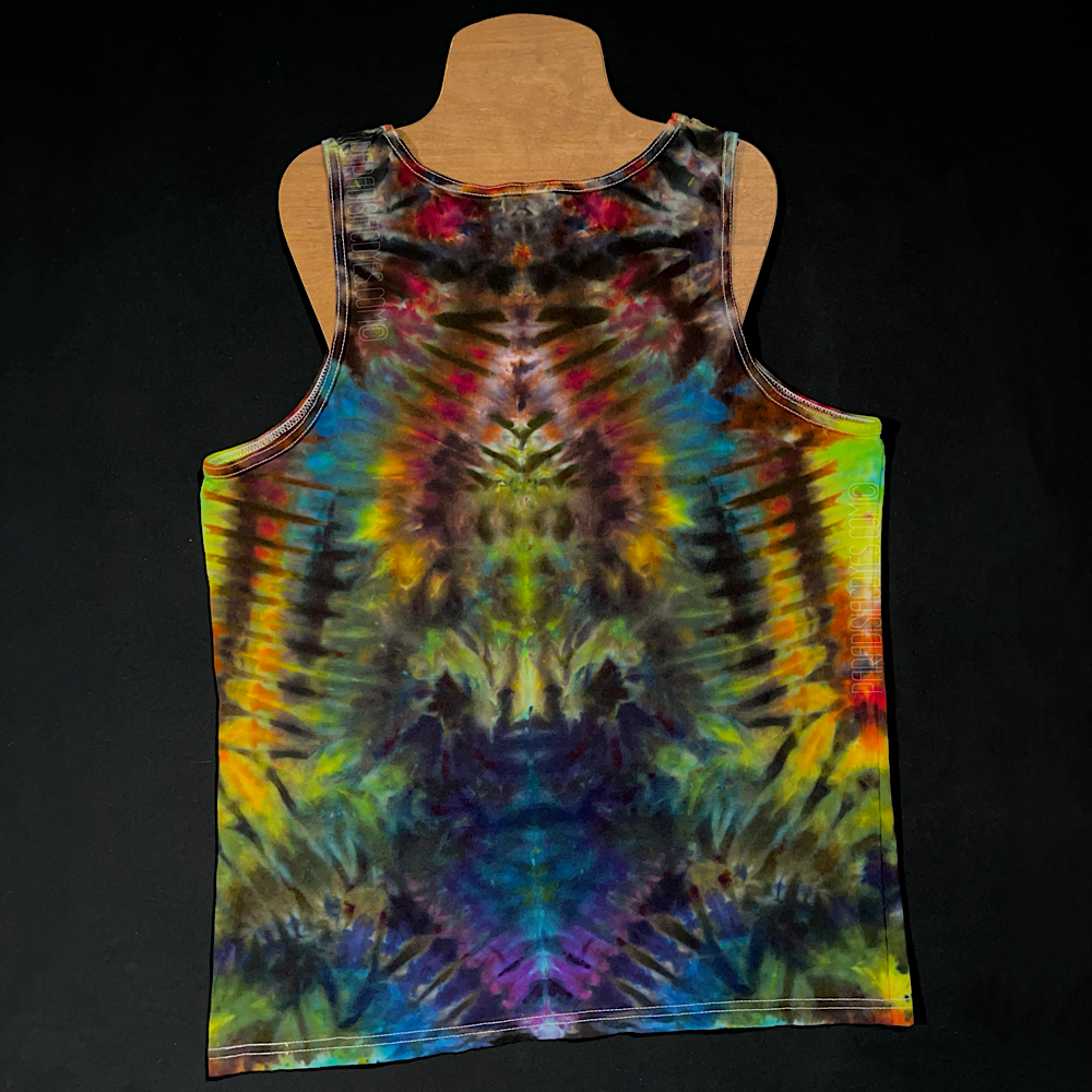 Front side of a size men's large Gildan tank top featuring a handmade, one of a kind rainbow ice dyed design in an abstract, symmetrical pattern; laid flat on a solid black background 