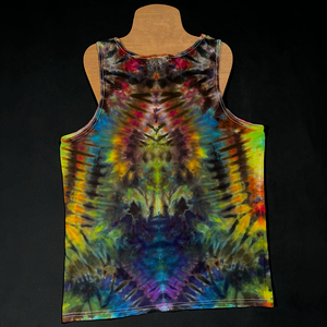 Back side of a size men's large Gildan tank top featuring a handmade, one of a kind rainbow ice dyed design in an abstract, symmetrical pattern; laid flat on a solid black background 