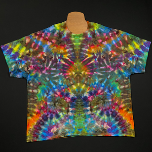 Front side of a size adult 4XL rainbow colored psychedelic mindscape ice dye t-shirt; an abstract, symmetrical, totem pole-like design