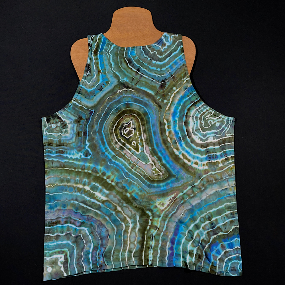Front side of a size adult XL unisex style tank top that features a distinctly unique, one of a kind agate geode inspired ice dye design on each side; in an array of dreamy blues, contrasted by earthy, neutral tones