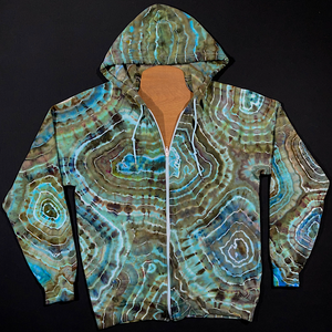 Front side of a zipup tie dye hoodie featuring an agate geode inspired ice dyed design with cool blues contrasted by earthy, neutral shades   