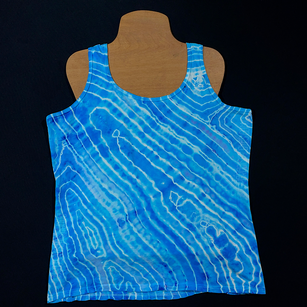 Back side of a size large ladies' racerback style tank top in an agate geode ice dyed design with vibrant, dreamy trii-toned blend of light sky and ocean blues