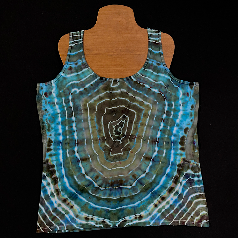 The back side of a ladies' racerback style tank top featuring a deep bud with earthy taupe browns geode pattern tie dye tank top, which features a totally different design from the front