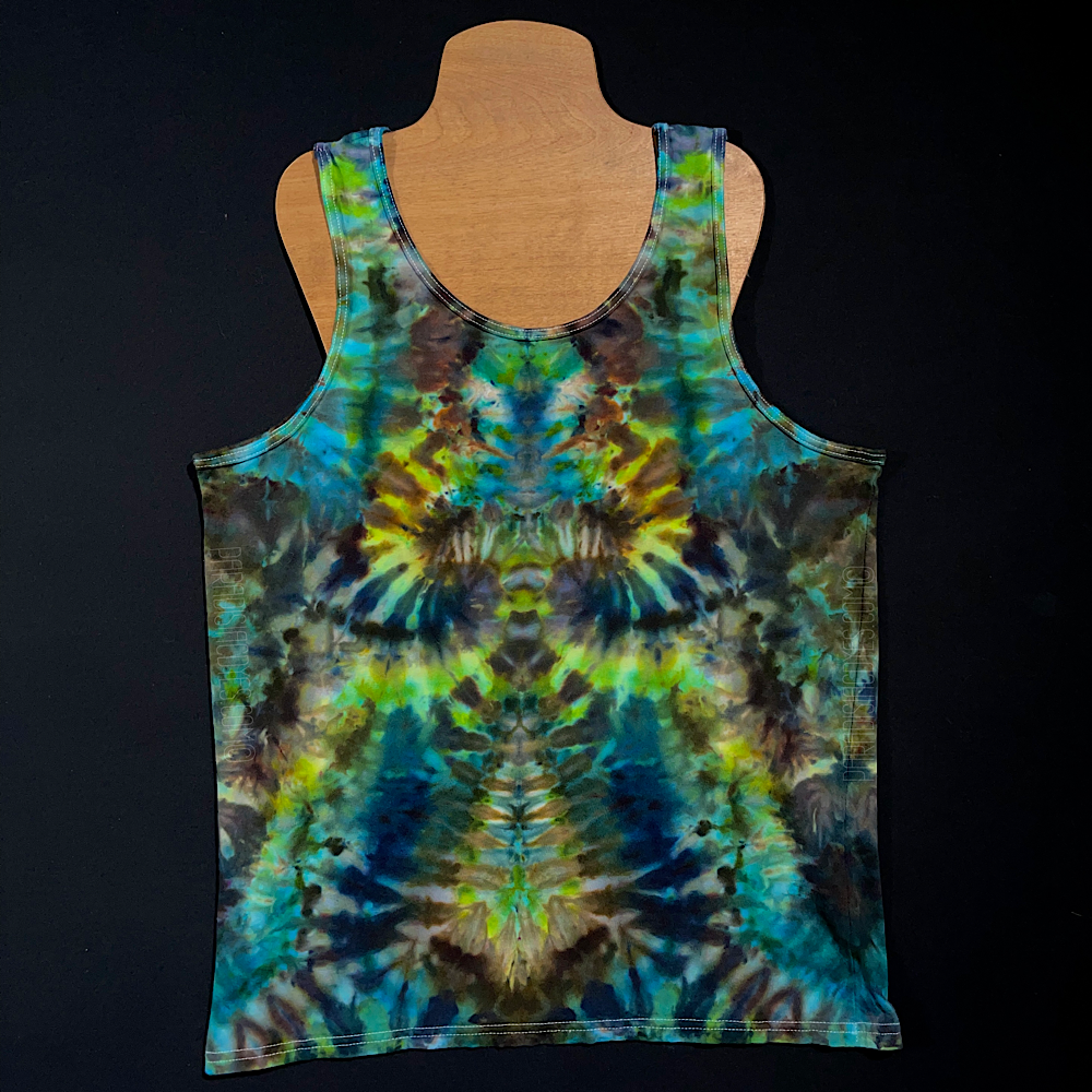 Front side of a men's large tank top featuring a cool blend of blue, green & earthy brown shades in an abstract, symmetrical, pareidolia inducing ice tie dyed design; displayed on a t-shirt mannequin on a solid black background